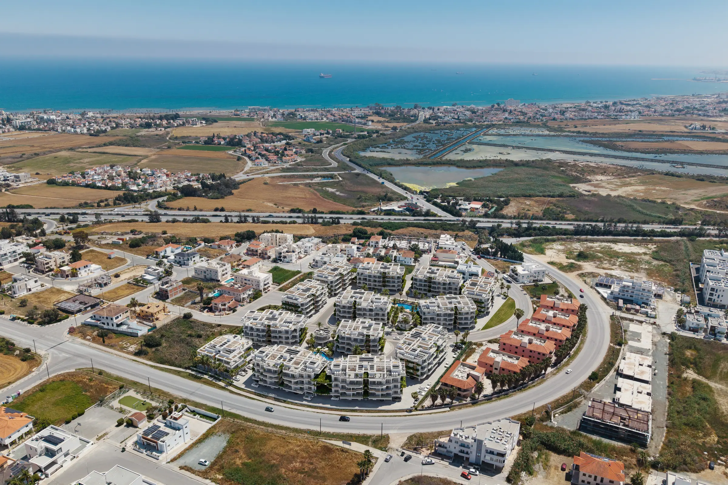 Aerial view of the development with the Larnaca Salt Lake beyond